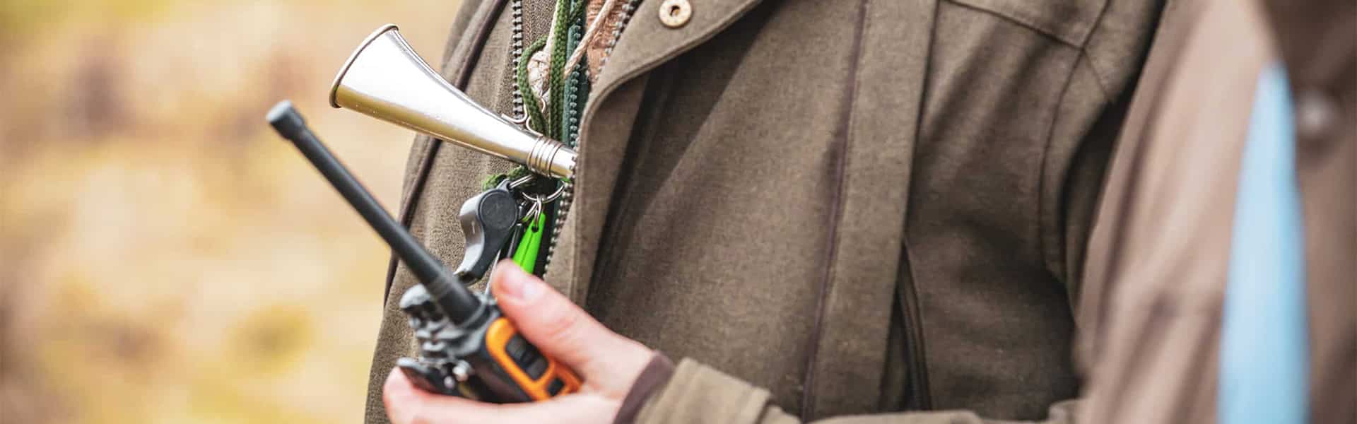 Gamekeeper holding a radio