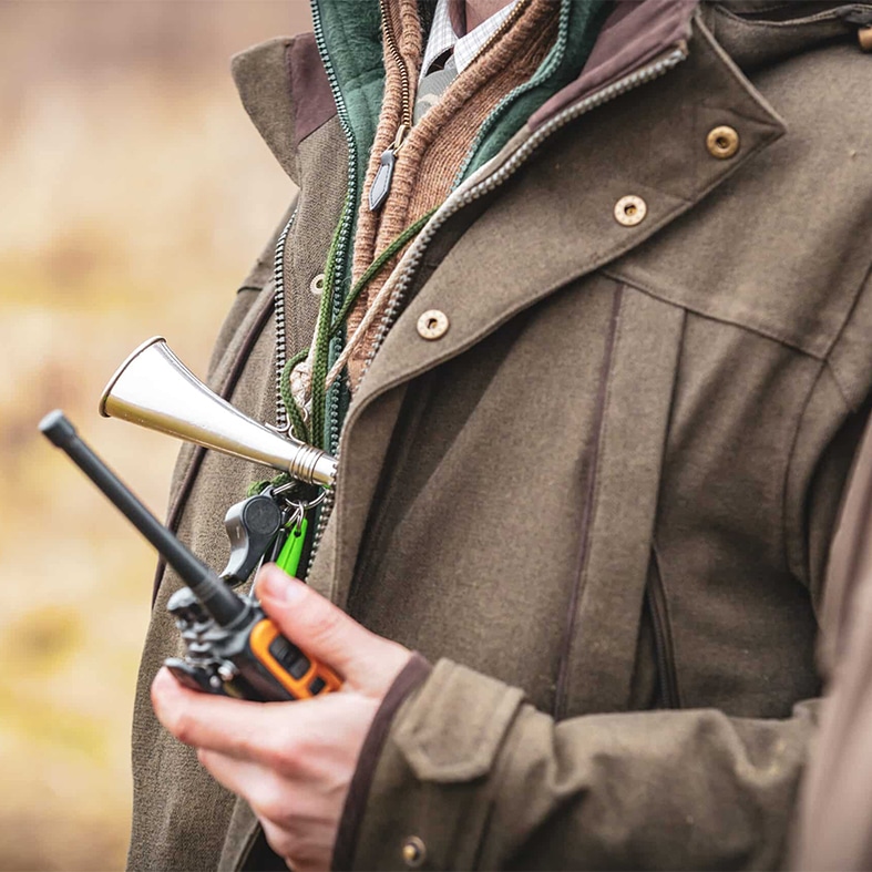Gamekeeper holding a radio