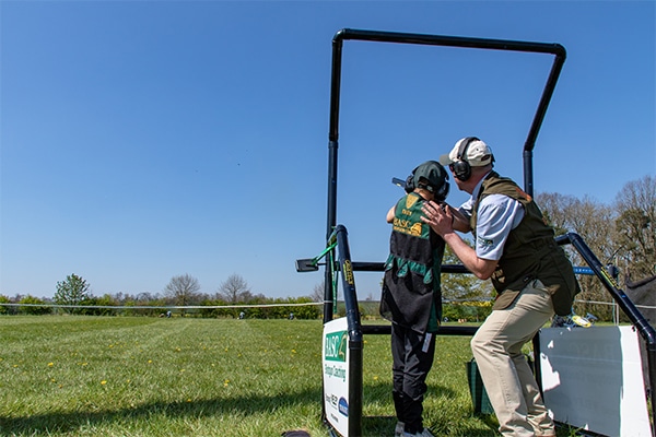 A basc coach teaching a student