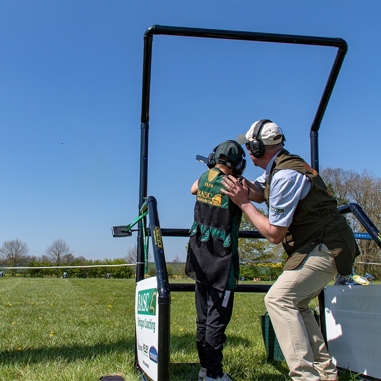 A basc coach teaching a student