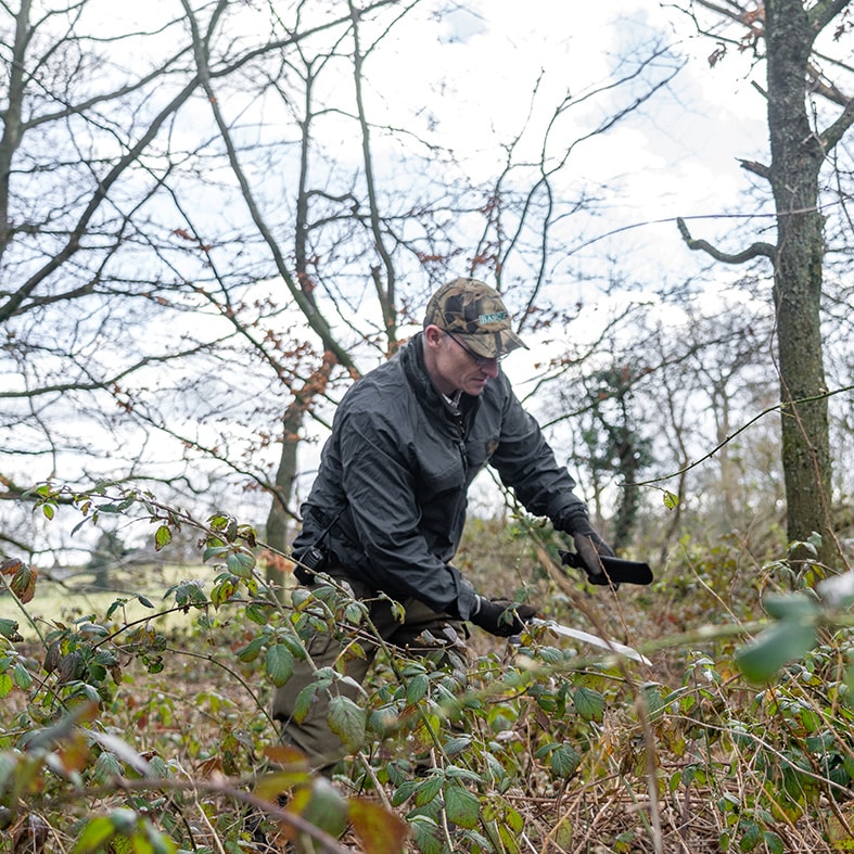 Gamekeeper managing woodland