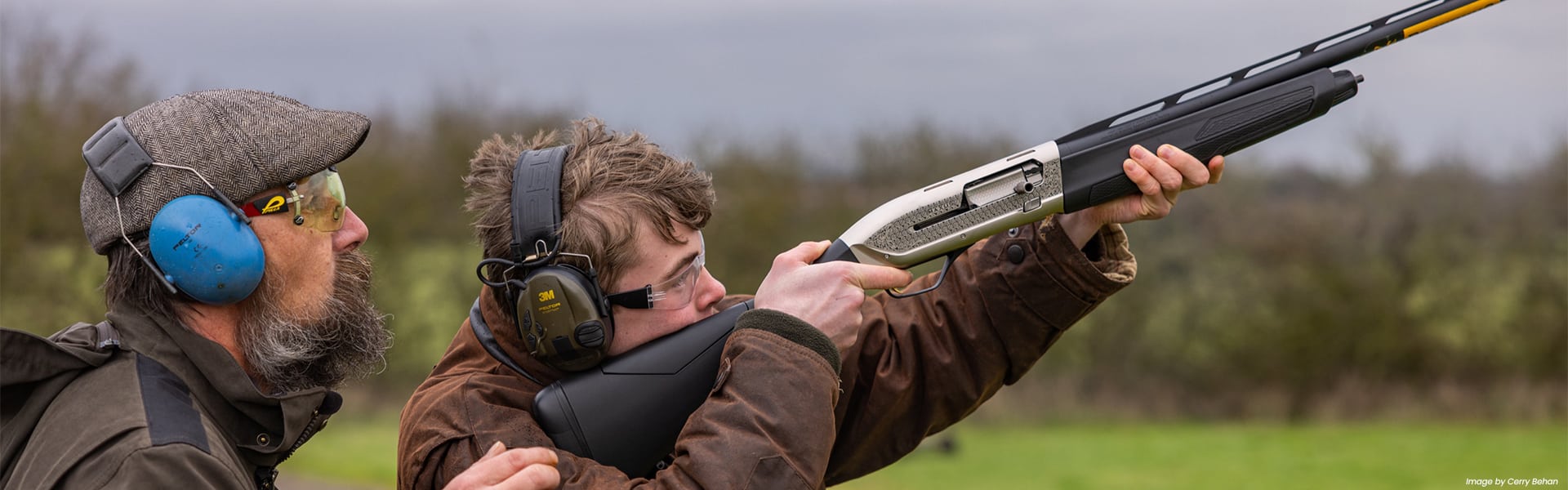 A young shot holding a shotgun