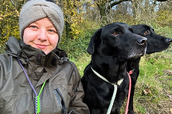 Toni Paull and two black labradors