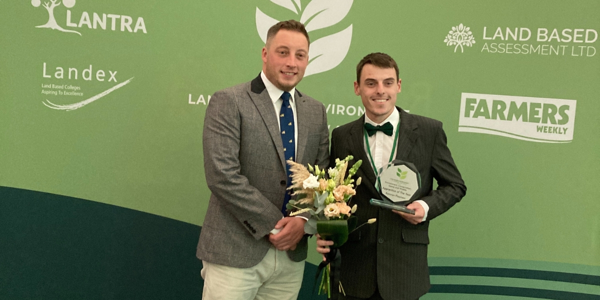 Kamran Flaxman receiving award