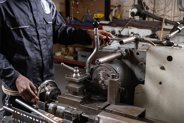 A BSA barrel being hand machined and inspected