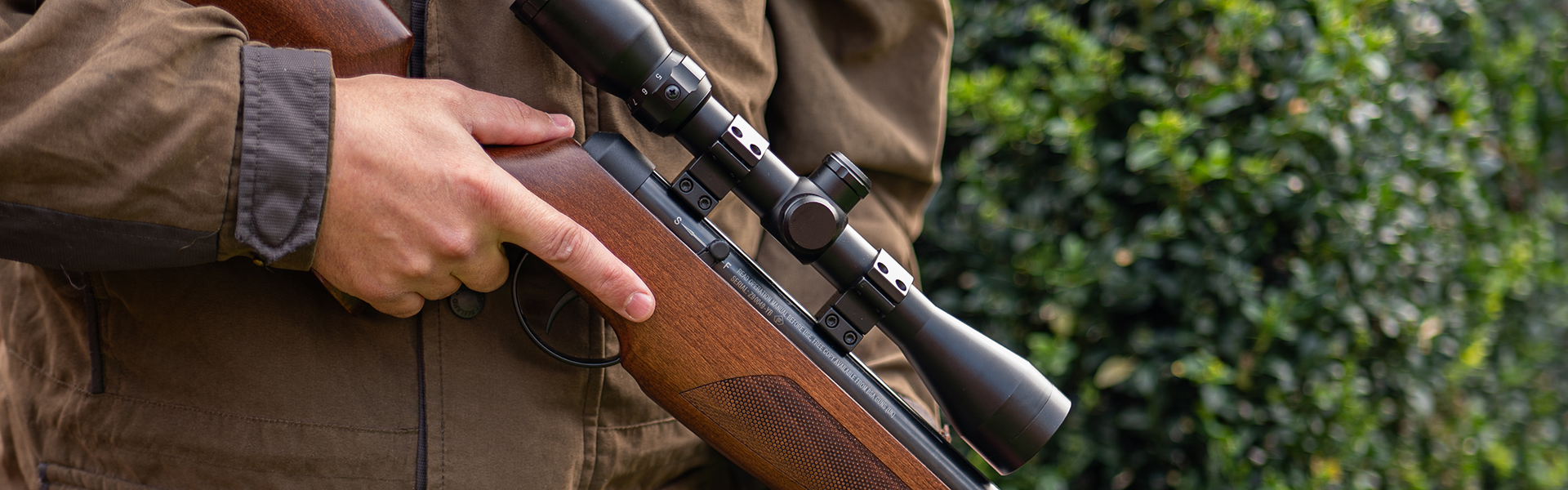 A man holding air rifle