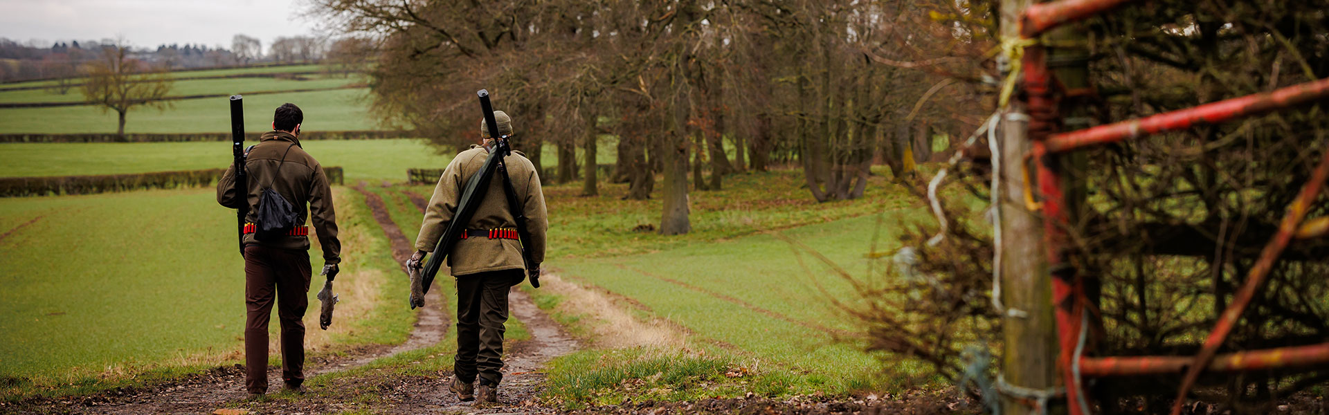 Two shooters walking along a path