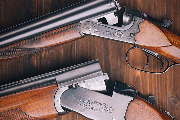 Two shotguns lying on a table