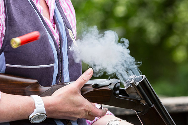 A shooter ejecting shotgun shells from their shotgun