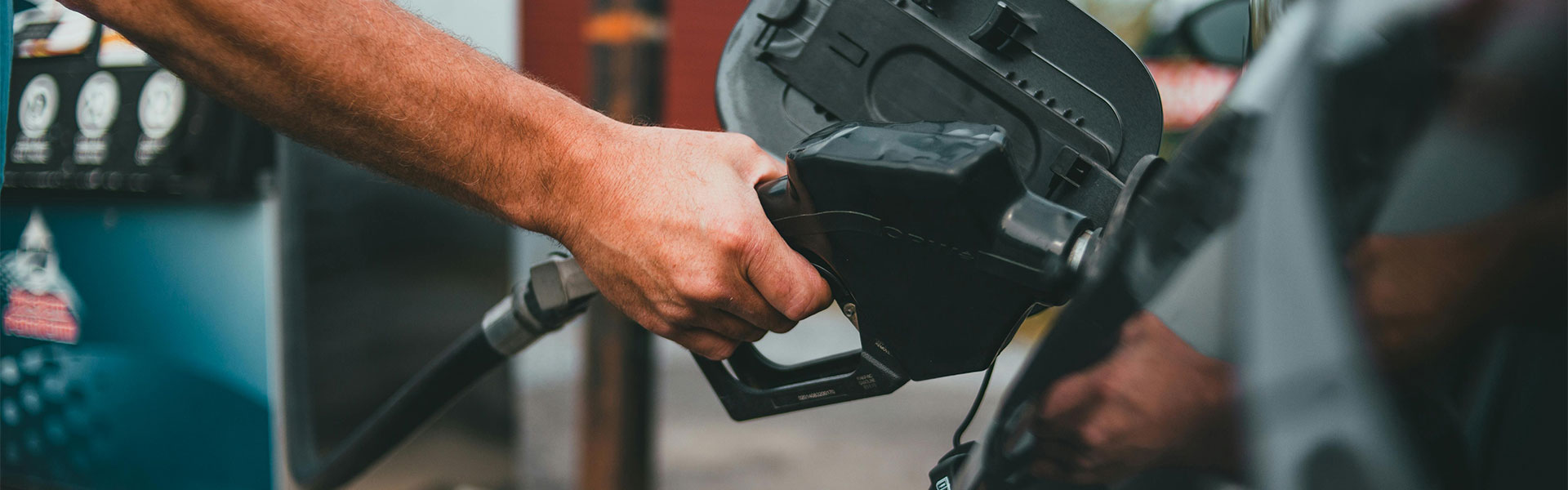 Someone filling up a car