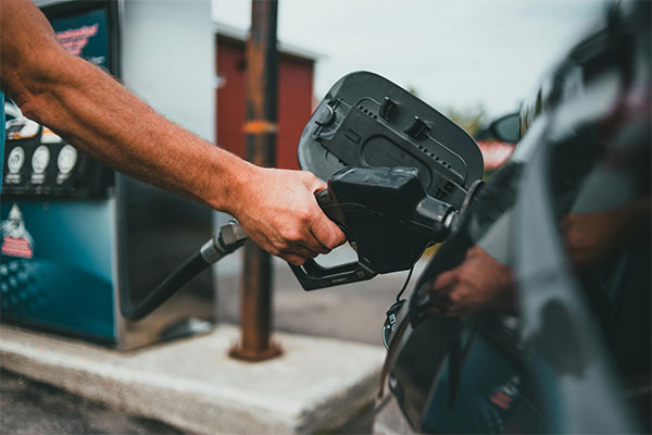 Someone filling up a car