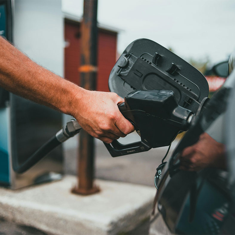 Someone filling up a car