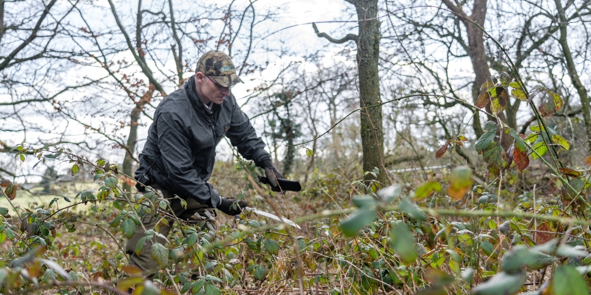 Using a machete for cutting undergrowth