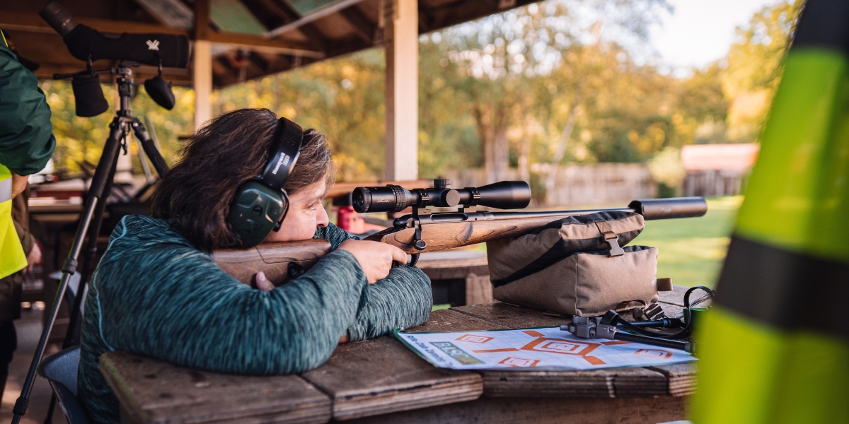 Women shooting rifle