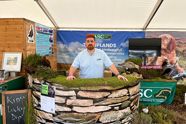 Alex Farrell at the Game Fair stand