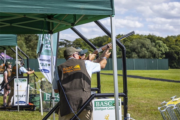 A shotgun coach with a student