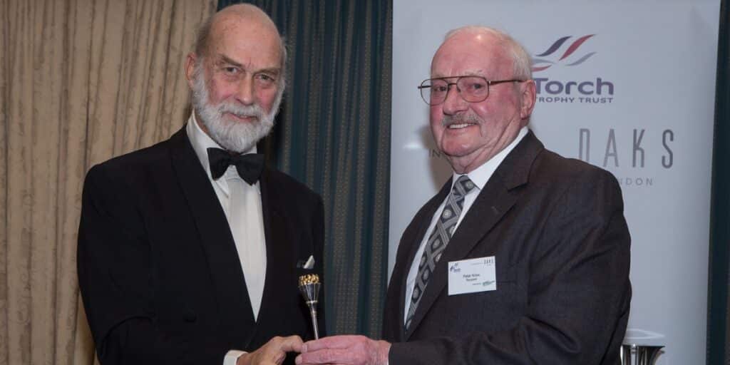 Peter Knox receiving his Torch Trophy from HRH Prince Michael of Kent