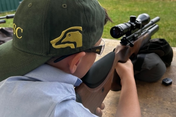 child shooting an airgun